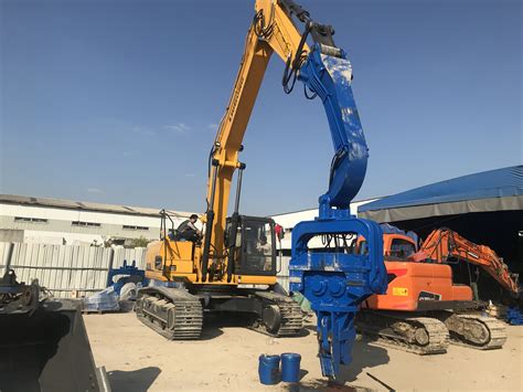 pile driving mini excavator|excavator mounted pile driving equipment.